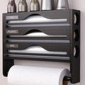 3-in-1 kitchen dispenser holding plastic wrap, foil and paper towel rolls in white plastic